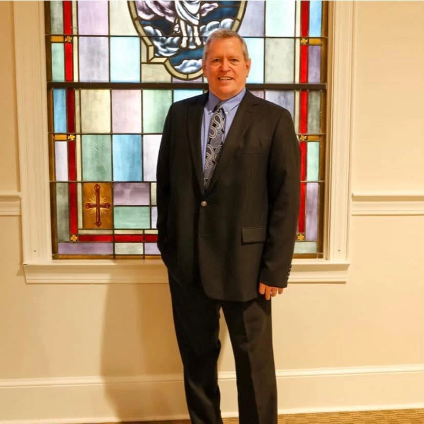 Walter James, pastor of Mt Zion Baptist Church, pictured in formal attire after preaching a wedding